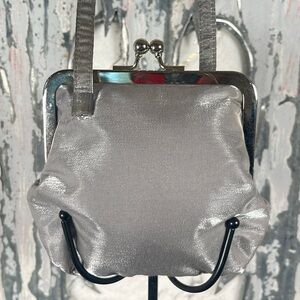 Carlo Fellini Vintage shimmering silver kiss-lock wristlet.